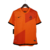 Camisa retrô laranja da Seleção da Holanda, modelo masculino da Nike, com detalhes em preto e o símbolo da KNVB.