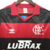 Camisa retrô do Flamengo de 1990, nas cores vermelha e preta, com logo da Adidas e patrocínio da Lubrax.