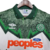 Camisa retrô do Celtic de 1991/1992, predominantemente verde, com detalhes em branco e laranja, fabricada pela Umbro.

