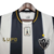 Camisa retrô do Atlético Mineiro 2013, modelo masculino, nas cores preta e branca, com detalhes em amarelo.

