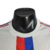 Camisa branca do Lyon Home 22/23, modelo jogador da Adidas, com detalhes em vermelho e azul.

