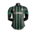 Camisa masculina do Celtic, modelo Away 22/23, na cor preta com detalhes em verde e listras verticais.