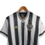 Camisa retrô do Atlético Mineiro, modelo 2020, nas cores preta e branca, com listras verticais e detalhes em dourado.

