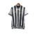 Camisa retrô do Atlético Mineiro, modelo 2020, nas cores preta e branca, com listras verticais e detalhes em dourado.