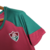 Camisa feminina do Fluminense, modelo de treino, com detalhes em verde e vermelho.