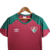 Camisa feminina do Fluminense, modelo de treino, com detalhes em verde e vermelho.