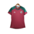 Camisa feminina do Fluminense, modelo de treino, com detalhes em verde e vermelho.