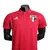 Camisa polo vermelha do São Paulo FC, modelo 23/24, com logo do time e detalhes da marca Adidas.