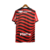 Camisa de torcedor do Flamengo III 22/23, vermelha com detalhes em preto e branco, com patrocínios visíveis.