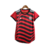 Camisa feminina do Flamengo III 22/23, vermelha com detalhes em preto e listras.