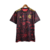 Camisa do Flamengo edição especial 23/24, vermelha com detalhes em preto e dourado, estampada com símbolos do time.