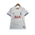 Camisa feminina do Tottenham Hotspur, modelo 22/23, na cor branca com detalhes em azul e o logo da Nike.