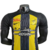 Camisa do Al-Ittihad I 23/24, masculina, preta com detalhes em amarelo e branco, da Nike.

