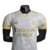 Camisa branca do Real Madrid, edição especial 23/24, com detalhes em dourado e logotipo da Adidas.

