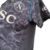 Camisa preta do Napoli, edição especial 23/24, com detalhes em branco e logotipos EA7 e MSC.

