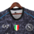 Camisa preta do Napoli, edição especial 23/24, com detalhes em branco e logotipos EA7 e MSC.

