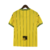 Camisa amarela do Norwich City I 22/23, com detalhes em verde e preto e logo da marca Joma.

