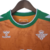 Camisa laranja do Real Bétis II 22/23, com detalhes em verde e logo da Hummel.

