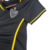 Camisa feminina do Atlético Mineiro III 23/24, na cor preta com detalhes em amarelo e logo do time.

