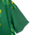 Camisa verde do Norwich City FC 23/24, com detalhes em amarelo e logo da marca Joma.

