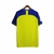 Camisa amarela do Al-Nassr I 23/24 para torcedores, com detalhes em azul e logotipo do time.

