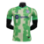 camisa-barcelona-número-iii-thrid-terceira-2024-2025-24-25-tons-de-verde-simbolos-cruz-e-letras-de-fundo-gola-redonda-verde-selo-comemorativo-125-anos-logo-nike-azul-e-um-menor-vermelho-escudo-tradicional-modelo-jogador