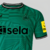 camisa-reserva-away-fora-número-ii-2-dois-newcastle-united-2023-2024-23-24-castore-verde-mosaico-grafico-gola-redonda-escudo-linhas-pretas-fundo-verde-logo-castore-patrocinio-sela-pretogola-redonda-preta-nufc-nuca-4