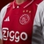 camisa-ajax-titular-home-casa-número-i-2024-2025-24-25-adidas-branca-branco-faixa-vermelha-gola-polo-retro-tres-listras-nuca-cruzes-amsterda-5