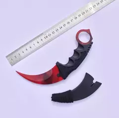 CUCHILLO KERAMBIT COLOR ROJO CON FILO FUNDA NEGRA PLÁSTICO RÍGIDO (A22-5)