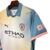 Camisa-Manchester-City-Away-202da-Etihad-Airways-24-25-away-torcedor-gola-puma-haland-azul-rosa-verde