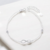 Pulsera con infinito y cubic con cadena extensible. Plata 925