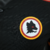 Emblema da camisa Roma III 23/24, com design em preto e detalhes em vermelho e amarelo.