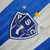 Emblema da camisa Paysandu I 24/25, branca com listra azul, mostrando as estrelas e a ave símbolo do clube.