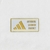 Emblema da Adidas com o texto "AUTHENTIC LICENSED PRODUCT", destacado em fundo branco.