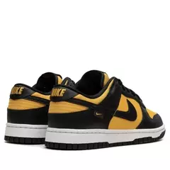 Nike Dunk Low Black/University Gold en internet