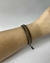 Pulseira de couro dourada com preto na internet