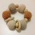 Sonajero pulsera beige