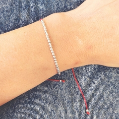 Pulsera tejida c/cuentas de plata