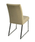 Silla SIMET 549 vista trasera, tapizada en tela beige con patas de metal.