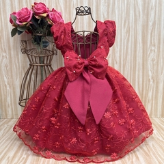 Vestido de festa infantil Esperanza vermelho com detalhes em flores e laço grande.