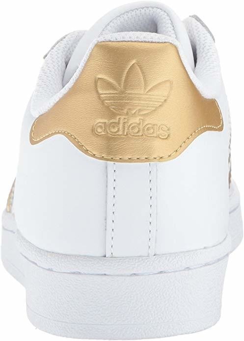 Tênis adidas best sale branco e dourado