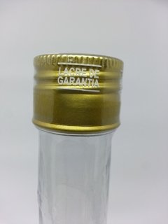 Lacre preformado transparente com a gravação na cor ouro LACRE DE GARANTIA.