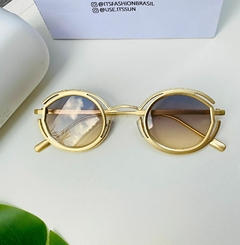 Óculos de sol feminino Groot dourado oval fosco - It's Fashion Brasil