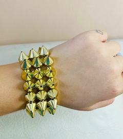 Pulseira spikes dourada