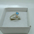 AN 069 Anillo Plata con Oro cruzado cubic celeste - tienda online