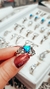 Imagen de Anillo solitario de acero con centro corazon de opalo y ondas laterales