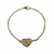 Pulsera de acero dorado con corazon central con cubics
