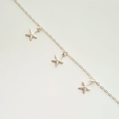 Pulseira infantil com pingentes estrela do mar prata